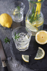 Detox water, fresh lemonade with ice, lemon and rosemary
