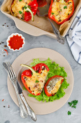 Oven baked sweet paprikas stuffed with mushrooms in cream sauce and cheese