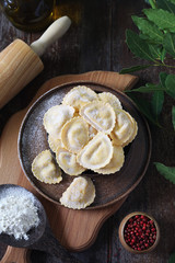 Italian Cuisine. Ricotta raw ravioli and olive oil