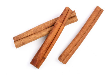Cinnamon sticks isolated on white background. Top view