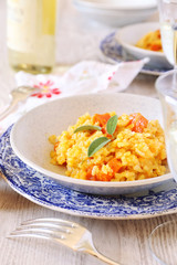 Pumkin risotto and glass of wine white