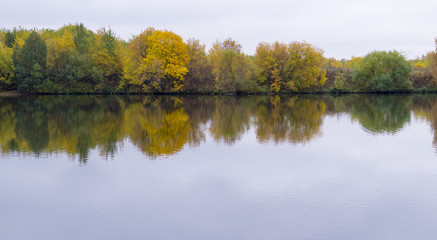 Fototapeta na wymiar calm river at rainy autumn morning. background, nature.