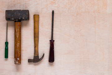 Hammers and other tools on a wooden table