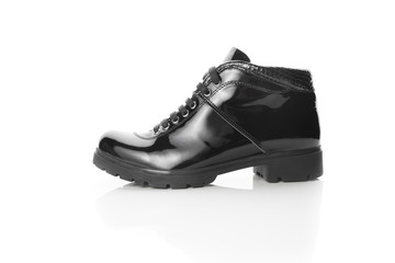 black varnished patent leather shoes isolated on white