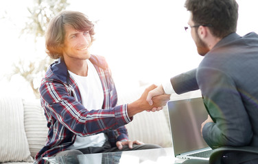 manager shakes hands with his client