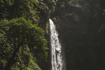 Huge waterfall Nung Nung in Bali jungle