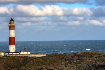 Fototapeta na wymiar Boddam lighthouse, Scotland, United Kingdom. February 2018. Buchan Ness lighthouse.