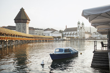View of the famous bridge Kapellbruecke (wooden chapel) in the evening in Lucerne
