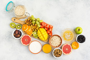 Top view of healthy breakfast with oats and fruits