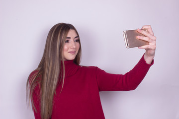 beautiful young girl taking selfie