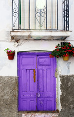 Fototapeta na wymiar Ultra violet old door. Purple colour