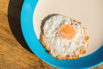 Fried eggs breakfast cooked on the plate.