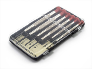 Small screwdriver to repair on white background