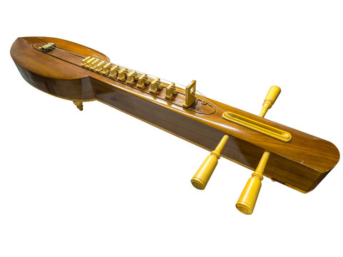 Thai traditional music instrument called zither  isolated on white background including clipping path.