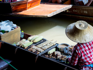 Mango stick ride at Floating market Dam Nern Saduak in Thailand.