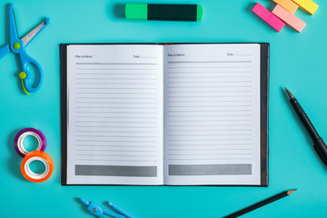 Fototapeta na wymiar blank notebook with office tools around
