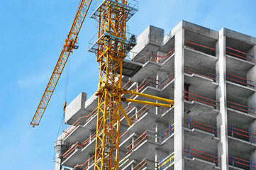 Crane and highrise construction site