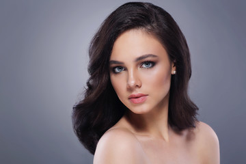 Young beautiful woman with fashion makeup, in black dress