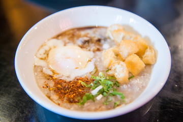 Rice porridge with egg and fried dough stick