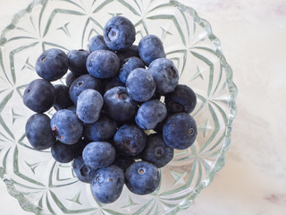 Glass bowl of fresh blueberries