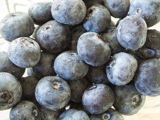 Closeup of blueberries in glass bowl