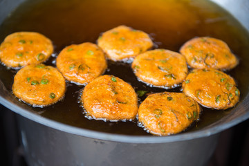 Make deep fried fish paste ball in a pan