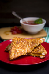 Classic Grilled Cheese and Tomato and Basil Soup in a Dark Environment