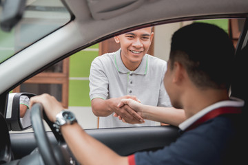 man driver shake hand