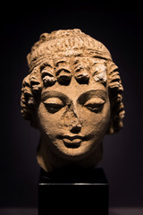 Fototapeta na wymiar ancient head of female deity stucco in 3rd - 5th century from Hadda, Afghanistan.