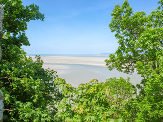 Fototapeta na wymiar Sandy beach, view from a walk around Mont Saint Michel.