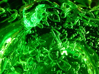 Fresh liquid macro background - sticky green healing gel aloe vera with bubbles and glare. Beautiful close-up structure