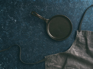 denim cotton apron on dark background, copy space