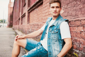 portrait of a trendy young man in the city.