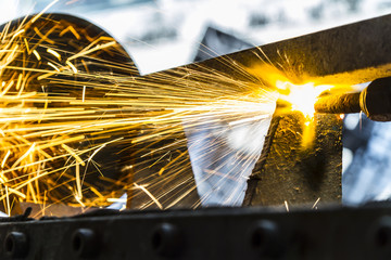 the worker cutting steel