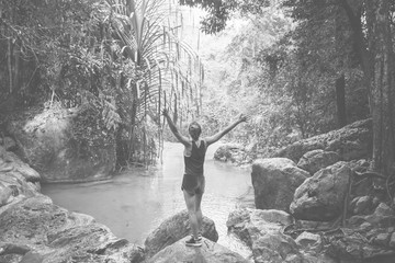 White woman enjoying the waterfall