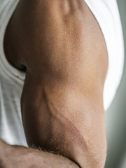 Fototapeta na wymiar Closeup of a black person's muscular arm