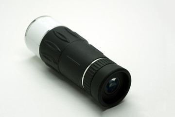 Black monocular telescope on tripod for bird watching.