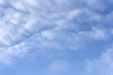 High white wispy cirrus clouds with cirro-stratus in the blue Australian sky sometimes called mare's tails indicate fine weather now but stormy changes coming within a