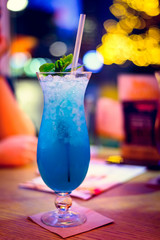 Cocktail on table, New Year, Christmas light decoration.