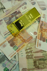 shining golden bullions on the russian flag background .