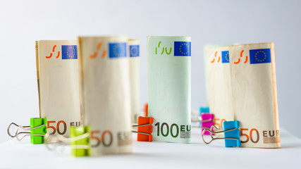 Several hundred euro banknotes. Euro banknotes random stacked. Euro currency money. Banknotes stacked on each other in different positions. Very shallow deep of field.