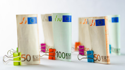 Several hundred euro banknotes. Euro banknotes random stacked. Euro currency money. Banknotes stacked on each other in different positions. Very shallow deep of field.
