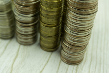 Pyramids of gold and silver coins. Many Russian rubles. Selective focus.Toned.