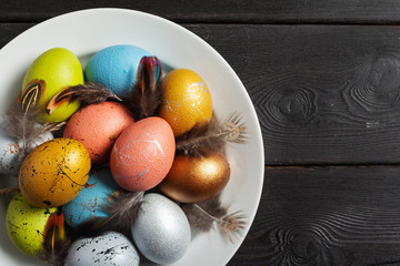 Happy easter! Easter eggs on wooden background