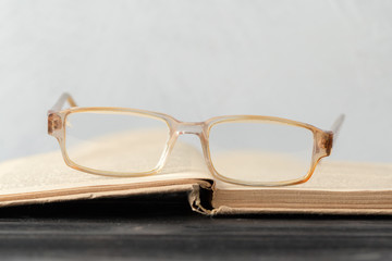 eyeglasses and book on the table