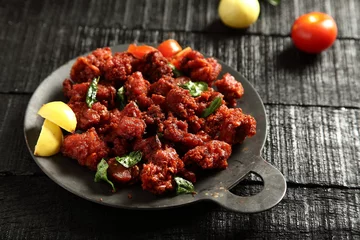 Wandcirkels aluminium Arabic cuisine- tasty ,spicy chicken fry non veg food concept. © susansam90