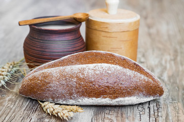 A loaf of rye  sourdough bread oval shape on a wooden Board vintage, rustic style, homemade cakes...