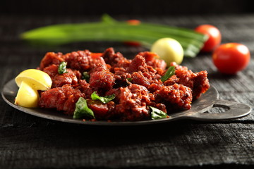 Traditional Indian food- spicy fried meat .