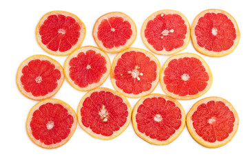 Round slices of the red grapefruit on a white background