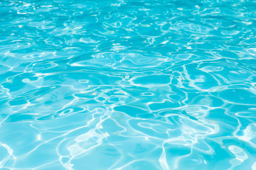 Blue water surface and ripple wave in swimming pool for background, Water level in pool with sunreflection abstract